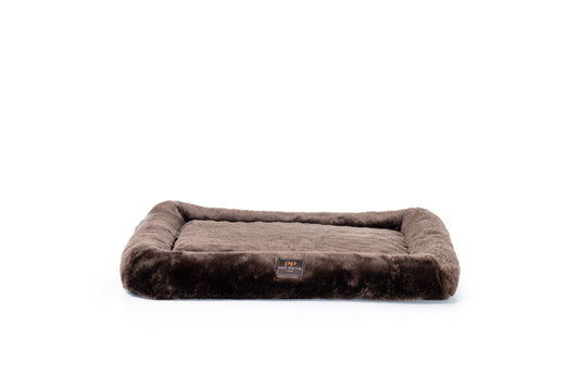 Brown pet bed with a visible brand logo on a white background