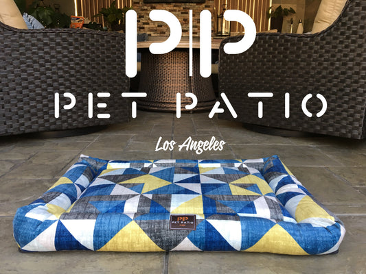 Blue triangle print orthopedic dog bed with washable removable cover